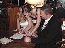 Maid of honor, Allison Wegg signing documents